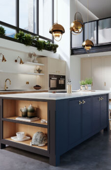 Kitchen with blue island with cooking area and wooden brown cleaning area.