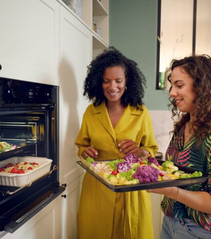 Two Women Using Neff Double Oven