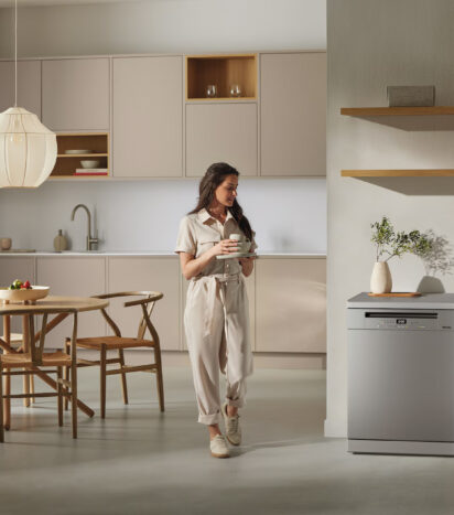 Miele Freestanding Dishwasher in Kitchen With Woman Walking