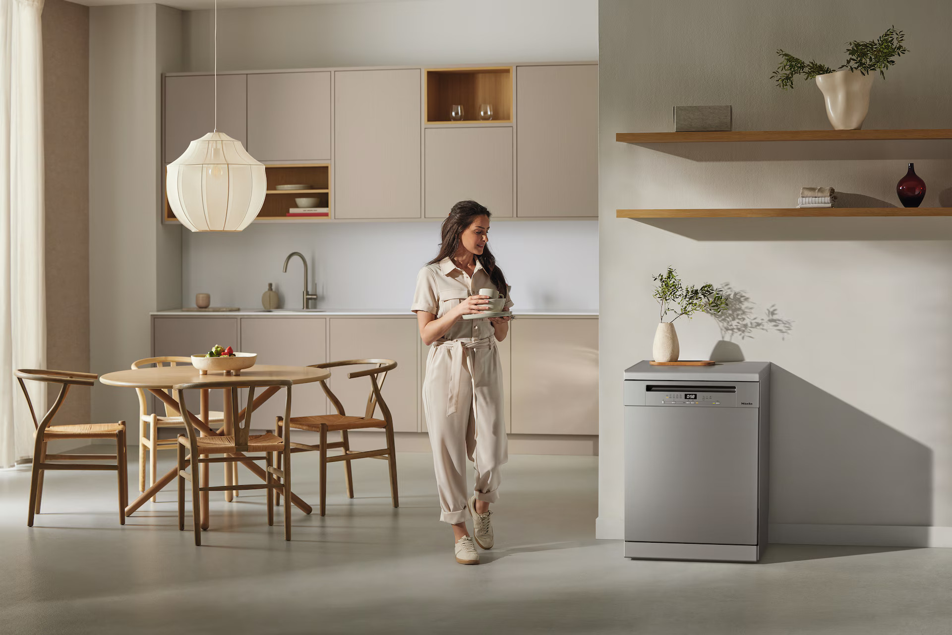 Miele Freestanding Dishwasher in Kitchen With Woman Walking